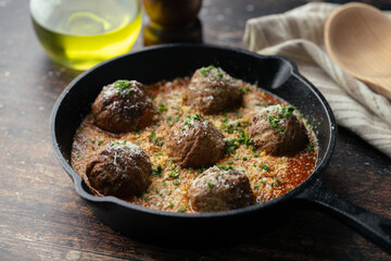italian meat balls with tomato sauce and cheese