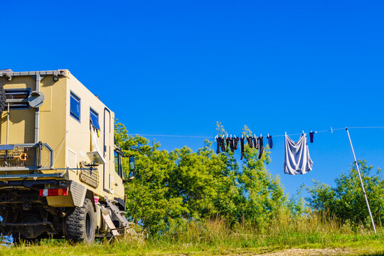 Camping. Clothes hanging to dry by rv lorry motorhome.