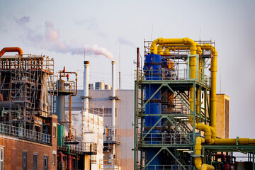 modern chemical plant in Frankfurt, Germany, factory with steam coming out of chimney, complexity...