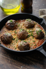 italian meat balls with tomato sauce and cheese