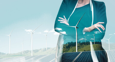 Double exposure graphic of business people working over wind turbine farm and green renewable energy worker interface. Concept of sustainability development by alternative energy. uds - obrazy, fototapety, plakaty