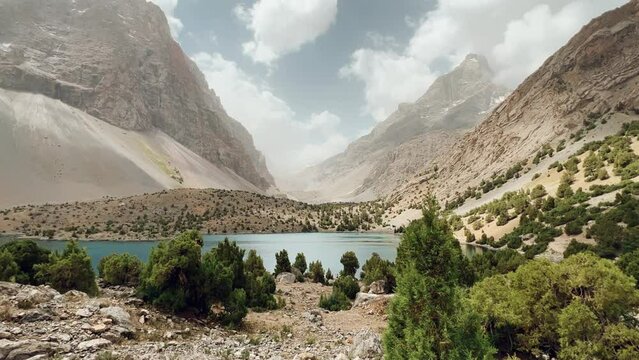 The Alaudin (Chapdara) lakes, lying at an altitude of 2800 m, are considered one of the most beautiful lakes of the Fan Mountains. Turquoise mountain lake. Pamiro-Alai. Tajikistan, Pamir 4K