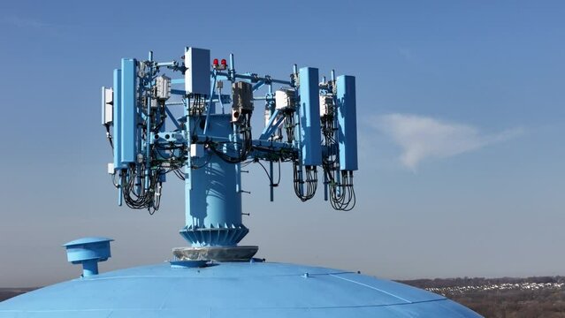 360 view of a cell phone antenna array mounted on top of a water tower