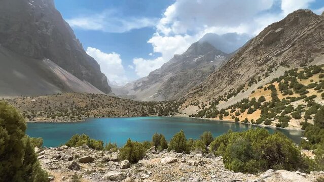 The Alaudin (Chapdara) lakes, lying at an altitude of 2800 m, are considered one of the most beautiful lakes of the Fan Mountains. Turquoise mountain lake. Pamiro-Alai. Tajikistan, Pamir 4K