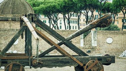 Ancient medieval catapult and cannon balls at the tower of the Sant'Angelo Castel Rome. Italy....