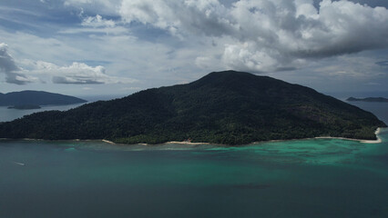 an aerial view of a small island in the middle of the ocean
