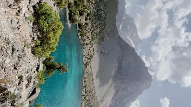 The Alaudin (Chapdara) lakes, lying at an altitude of 2800 m, are considered one of the most beautiful lakes of the Fan Mountains. Turquoise mountain lake. Pamiro-Alai. Tajikistan, Pamir 4K