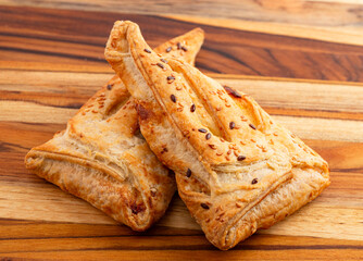 Triangle Khachapuri Filled with Soft Cheese and Sprinkled with Toasted Sesame Seeds