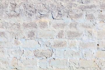 A wall with a white and blue brick pattern