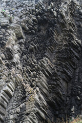 texture of porous stones on the beach, nature, natural phenomena, grey stones, columnar stones