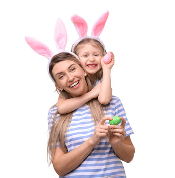 Easter celebration. Mother and her cute daughter with bunny ears and painted eggs isolated on white