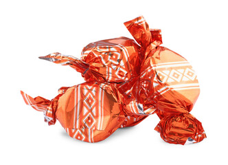 Candies in orange wrappers isolated on white