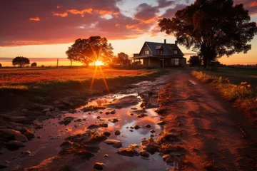 Wandcirkels tuinposter Muddy road through natural landscape, leading to house at twilight © yuchen