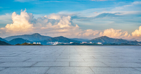 Empty square floor and green mountain with beautiful sky clouds nature landscape at sunrise. Panoramic view.