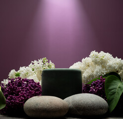 minimalistic composition of stones and flower plants for the podium. podium made of stones for the presentation of perfumery, cosmetics, medicine, jewelry products