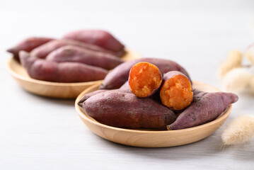 Boiled sweet potato on wooden plate