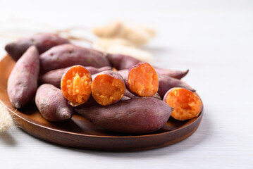 Boiled sweet potato on wooden plate