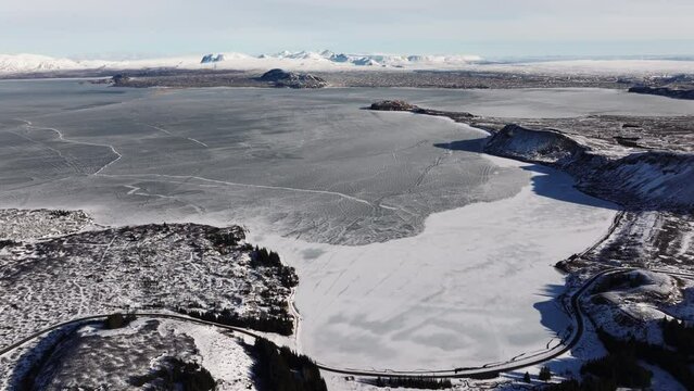 Aerial video over National Iceland Thingvellir in a snowy winter.