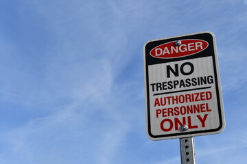 Danger, No Trespassing, Authorized Personnel Only sign.