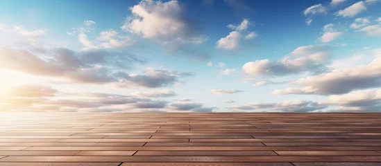 Zelfklevend Fotobehang A wooden deck overlooking a vast grassland prairie with cumulus clouds filling the sky, creating a serene natural landscape against the horizon © 2rogan