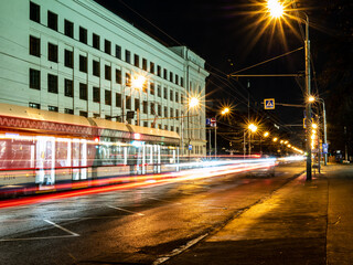 long exposure tram in a blurry form in the night city center , Moscow, Russia. low light shoot