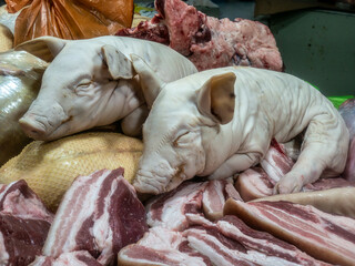 Two pig on the counter in the market. The meat Department in the store. color nature