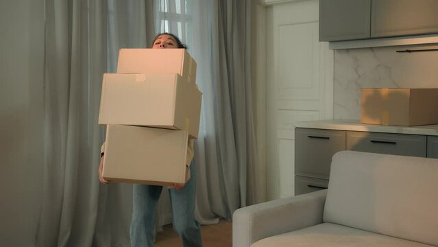 African american woman carrying heavy cardboard boxes delivery moving in new apartment move relocation tired girl carry packages lost balance fall drop parcels crash fail upset displeased lady at home