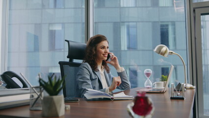 Girl consultant talking phone sitting luxury office close up. Woman consulting 