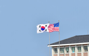 Flying the American flag and South Korean Flag, Star-Spangled Banner and Taegeukgi