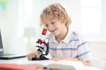 School kids with microscope. Science class.