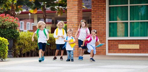Child going back to school. Start of new school year after summer vacation. Little girl with...