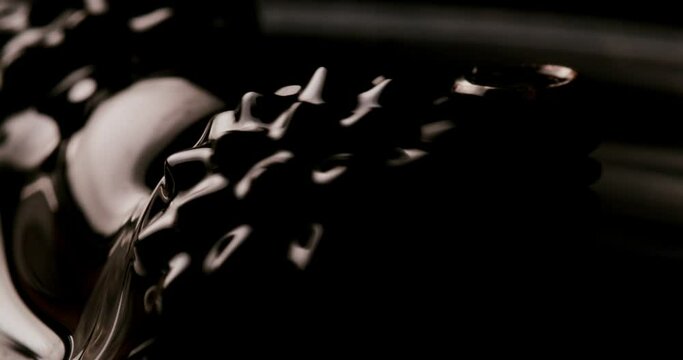 Experimental: Black orbs twitching. Consisting of ferromagnetic fluid and reacting to magnets