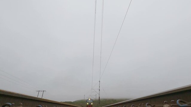 LKAB train and iore locomotive passing over the camera on a cloudy day