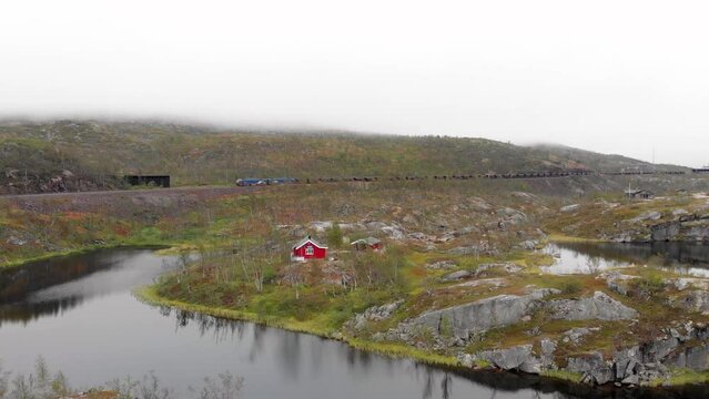 Aerial: ore train in S&oslash;sterbekk stasjon, close to the border between Sweden and Norway in north Lapland