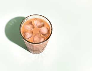 Iced latte coffee drink with heart shaped ice cubes