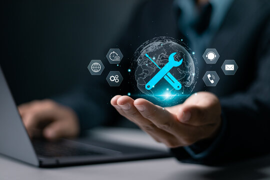 Maintenance concept. Repair about assistance and servicing of equipments, technical support, assistance and service. Businessman using laptop with maintenance icon on virtual screen.