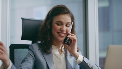 Successful girl entrepreneur calling telephone sitting luxury office close up.