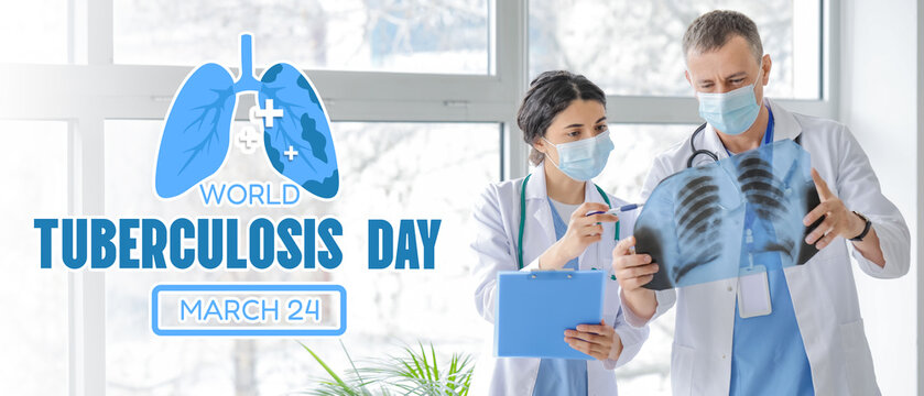 Doctors studying x-ray image of lungs in clinic