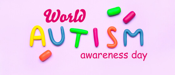 Word AUTISM made of plasticine on lilac background
