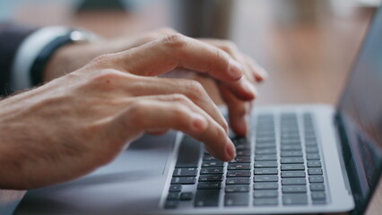 Freelancer hands typing computer keyboard closeup. Businessman working on laptop