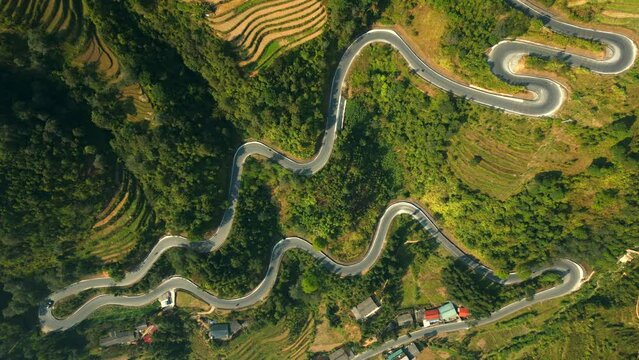 Top view of scenic winding road in the mountains on the Ha Giang Loop, North Vietnam.