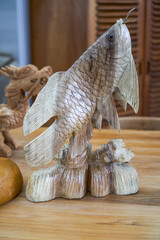 A lifelike carp wood carving ornament