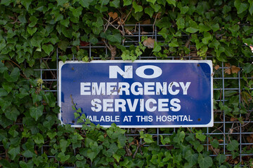 No emergency services sign on fence