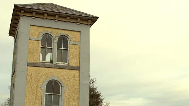 Tilt up shot of iconic Fisheries Tower in Galway City centre, Ireland