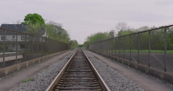 Moving backwards Establishing shot of train tracks with leading lines