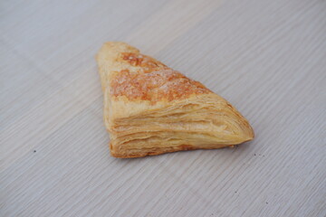 Puff Pastry on a wooden table. Selective focus.