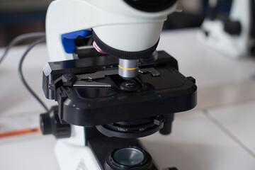 Microscope photographs in incognito laboratory. Concept of science and research.