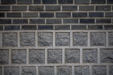 The view of Front view of traditional stonewall of Korean building architecture of bukchon Hanok Village in Seoul, South Korea 