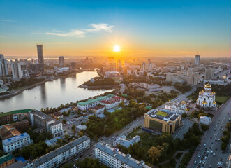Yekaterinburg city and pond aerial panoramic view at summer sunset. View from Vysotsky skyscraper
