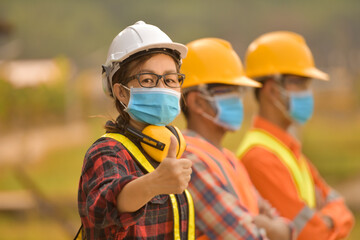 A woman Construction worker with hardhat ,Portrait Of Woman Architect On Construction Site
